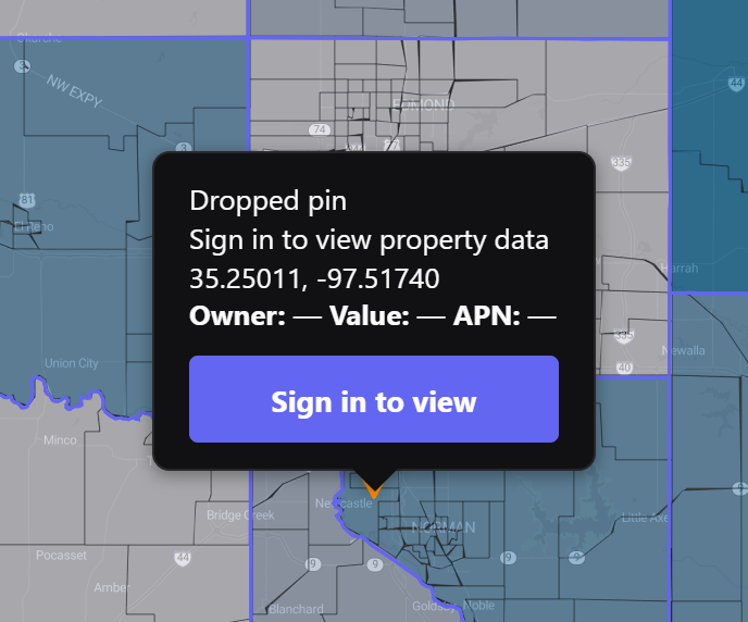 The dropped-pin property lookup opening over an active data layer